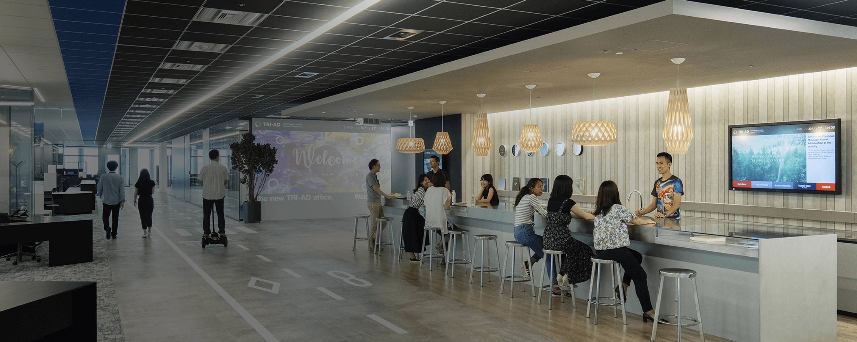 Employees collaborating in open office space reflecting diverse teamwork