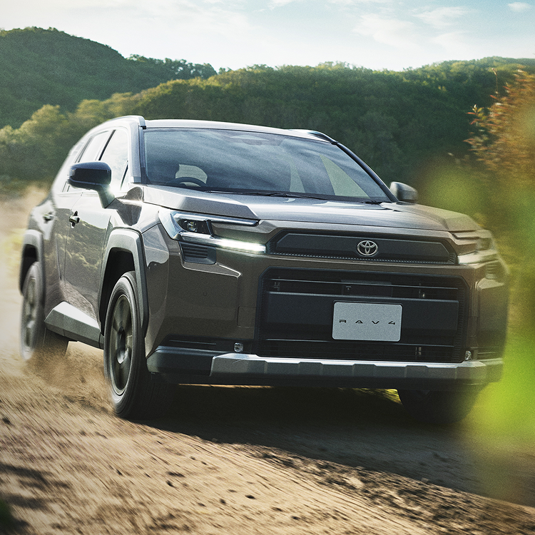 Toyota RAV4 SUV driving on rugged terrain demonstrating software-defined vehicle capability