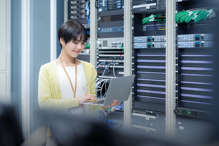 Engineer managing cloud infrastructure in data center environment