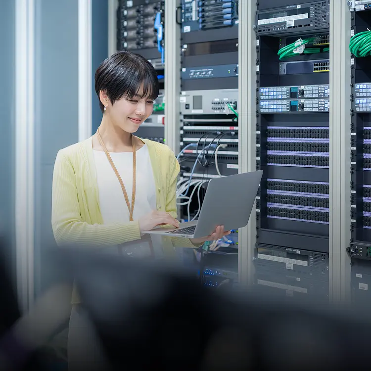 Engineer managing cloud infrastructure in data center environment