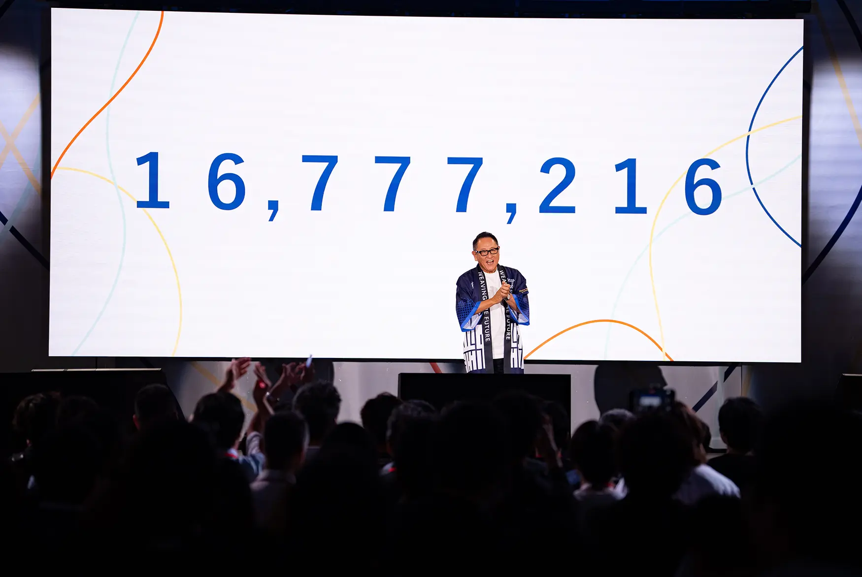 Chairman Akio Toyoda presenting on stage to audience during the Woven City launch event