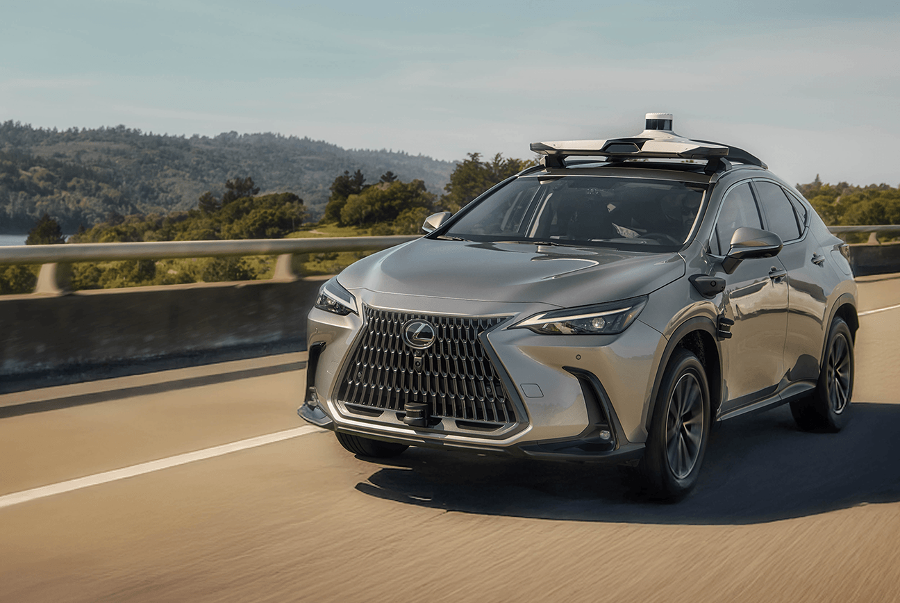 Lexus SUV equipped with sensors driving on highway using automated driving technology